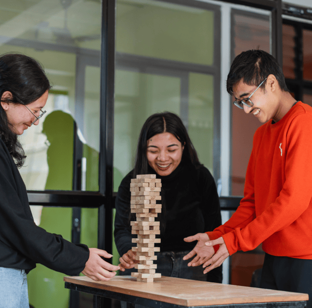 Collaborative software team enjoying downtime, highlighting a fun and inclusive work culture.