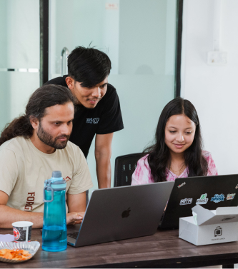 Trainees collaborating on a project during the traineeship program.