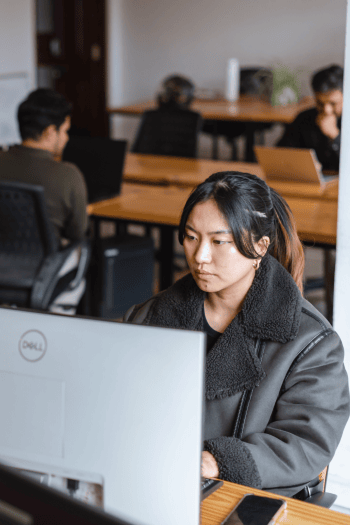 Developer building a custom software solution as part of managed IT services.