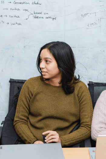 Team member contributing to software planning during a development session.